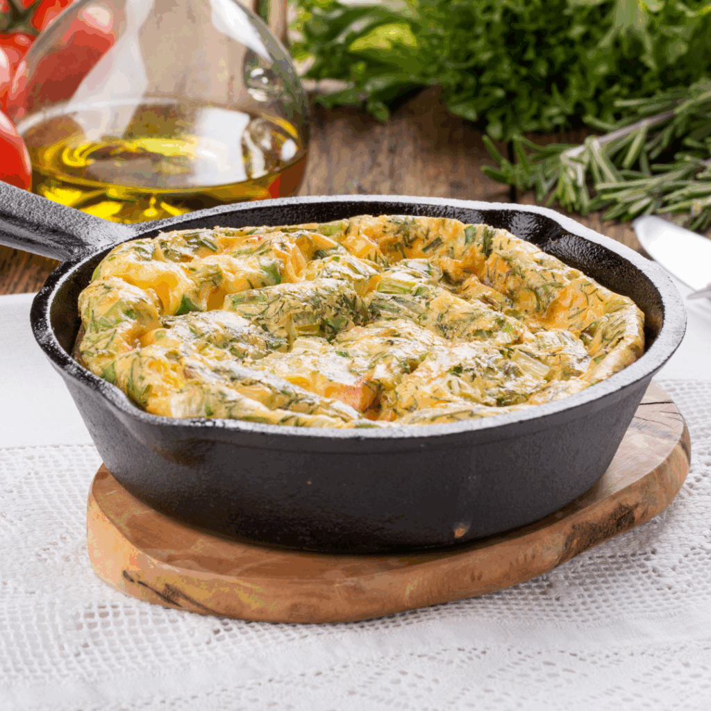 Smoked Salmon Frittata in a hot iron pan fresh from the over.