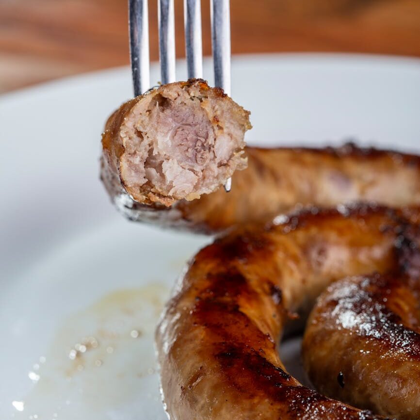 fork holding sausage