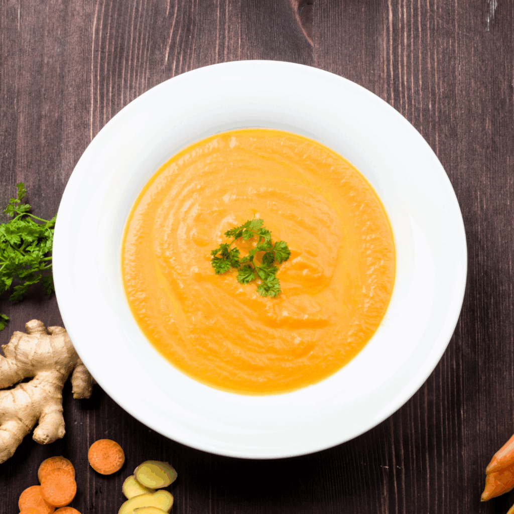Image of a garnished bowl of Rutabaga and carrot soup.