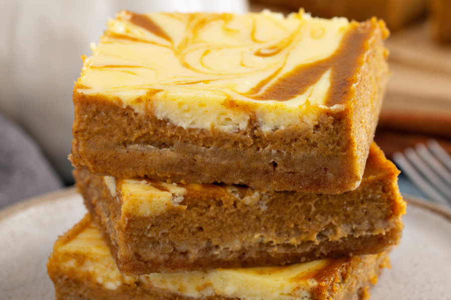 Three stacked pieces of Pumpkin Cheesecake